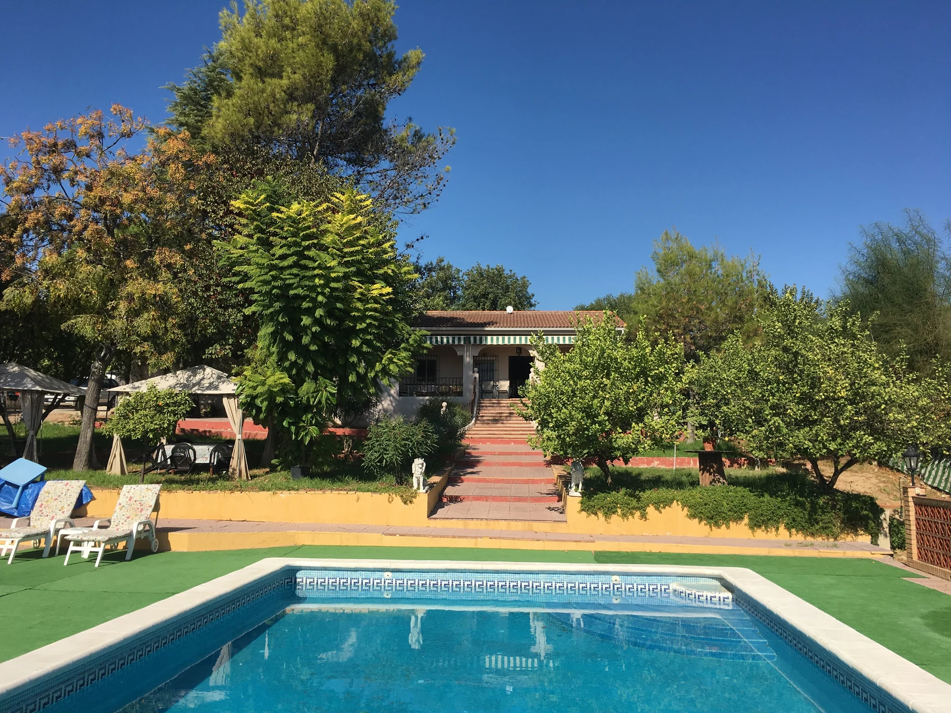 Archive photograph of the villa, garden and swimming pool at No 55 Cueva Bajas